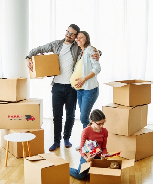 Happy family packing boxes with Harry The Mover for best interstate move from Melbourne.